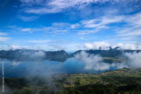 Danau Maninjau is an impressive volcanic lake at the bottom of an ...