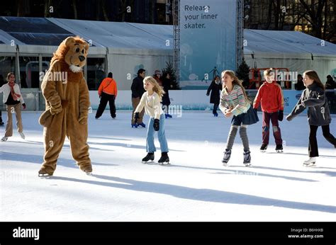 Girls Ice Skating with Lion Mascot in Bryant Park New York (For Editorial Use Only Stock Photo ...