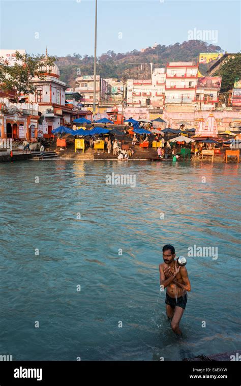 Hindu man bathing in Ganges river in Haridwar Stock Photo - Alamy