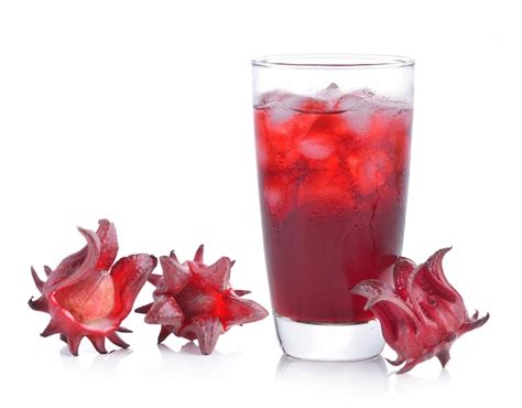 Premium Photo Roselle Flower Juice In Glass With Ice Isolated