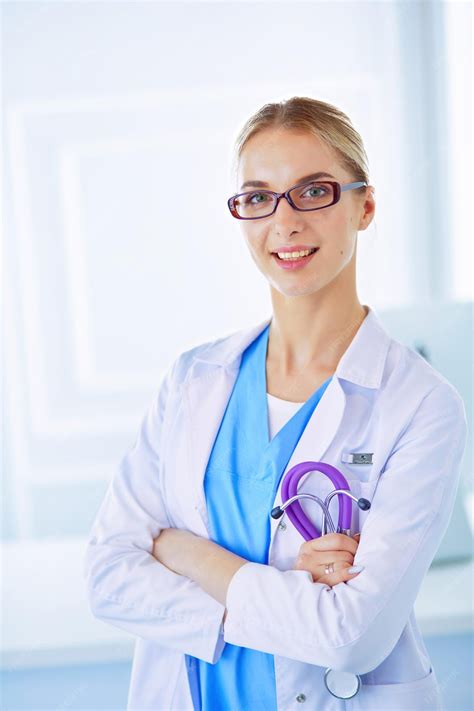 Premium Photo | Young nurse with stethoscope nurse in green scrubs with