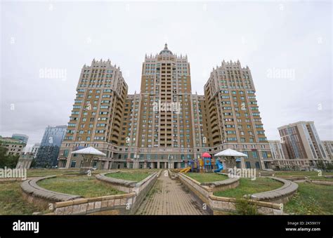 Cloudy Grey View Of The Looming Iconic Triumph Towers Modeled After