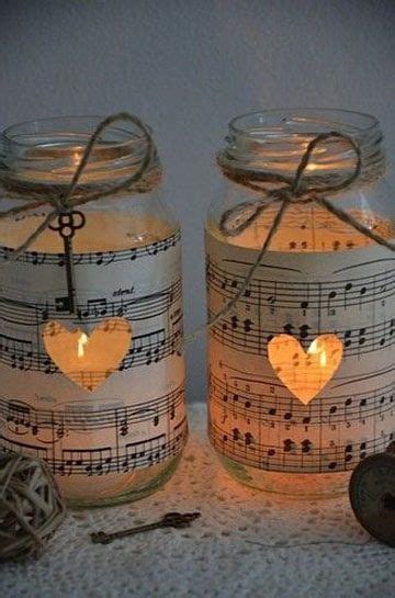 Two Mason Jars With Musical Notes On Them