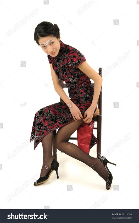 Classy Asian Woman In Traditional Cheongsam Qipao Sitting And Removing