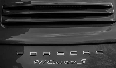 Porsche 911 Carrera S Emblem Photograph by Claire Doherty