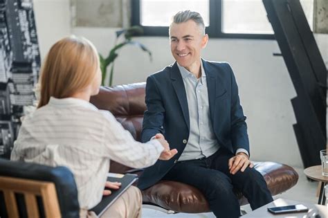 Premium Photo Blonde Psychologist Talking To A Male Patient At Her Office