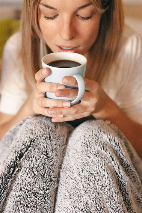 Beautiful Young Woman Drinking Coffee On The Morning At Home By