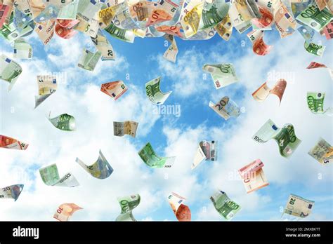 Falling Euro Banknotes And Blue Sky On Background Money Rain Stock