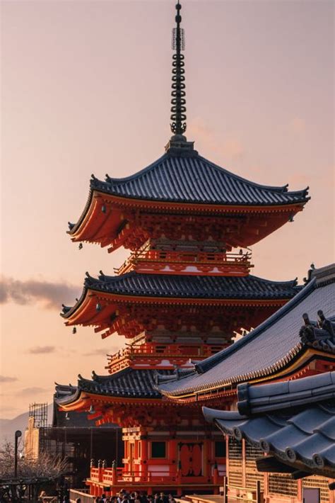 The Pagodas Are All Different Colors And Sizes But One Is Red In Color