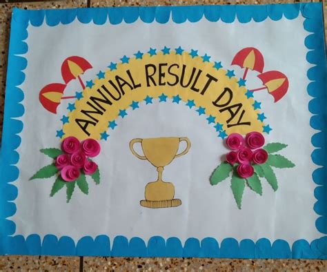 a paper sign with flowers on it that says annual result day and a gold cup