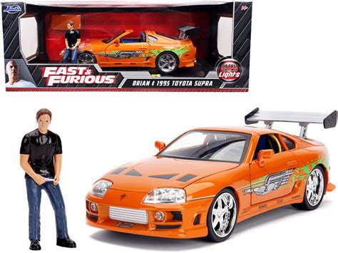 1995 Toyota Supra W Lights And Brian Figurine Fast And Furious Jada Toys 31139 1 18 Diecast