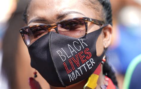 PHOTOS: People visit the Michael Brown memorial in Ferguson on the