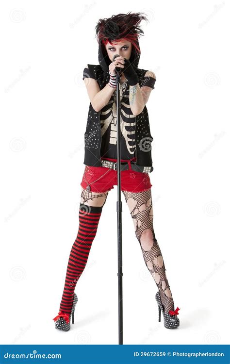 Portrait Of Female Punk Rock Musician With Microphone Over White