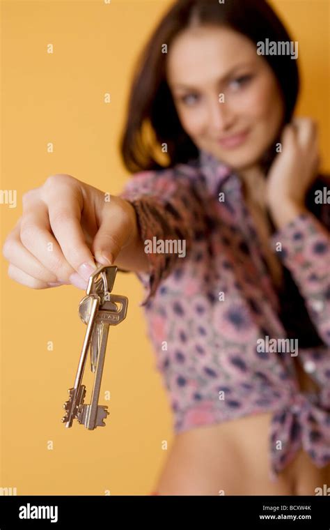 Woman Holding Keys Stock Photo Alamy