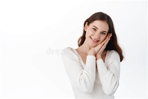 Cute Beautiful Natural Brunette Girl Cleaning Face With Cotton Sponge Smiling Looking At Camera