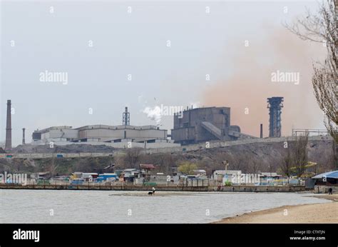 View at the beach with Azovstal steel plant in background Stock Photo ...
