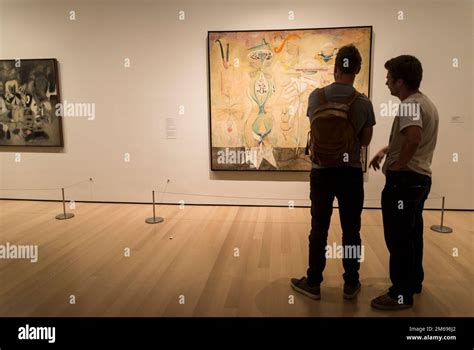 Visitors Looking At Mark Rothko Painting Slow Swirl At The Edge Of The