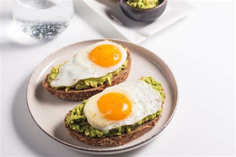 Premium Photo Avocado Egg Sandwich With A Glass Of Water Healthy