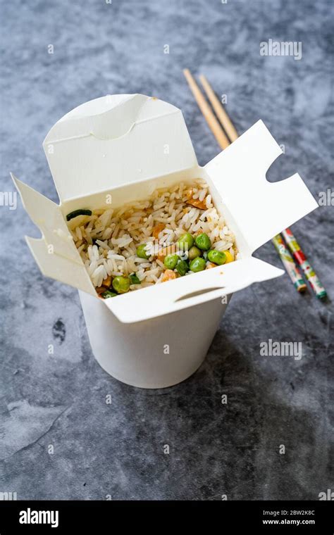 Take Out Chinese Rice With Green Peas And Almond In Plastic Box Package