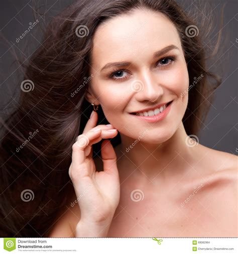 Close Up Portrait Of Elegant Brunette Woman With Nude Make Up Stock