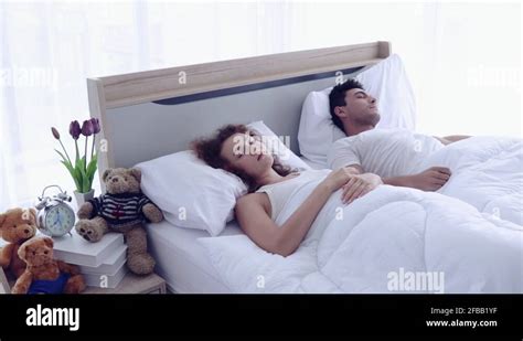 Couple hug bed Stock Videos & Footage - HD and 4K Video Clips - Alamy