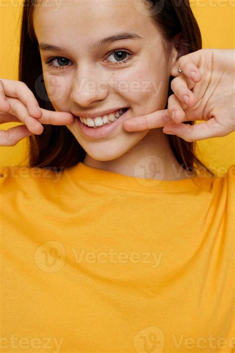 Photo Pretty Girl In A Yellow T Shirt Emotions Summer Style Yellow Background 25698953 Stock