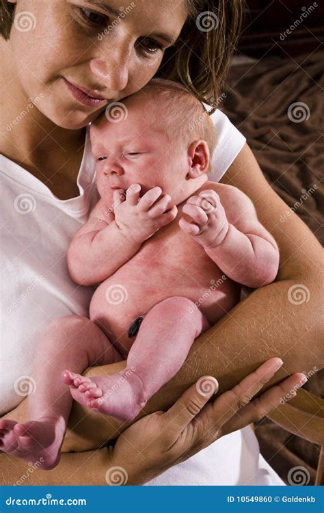 Mother Holding Newborn Baby In Her Arms Stock Photo Image