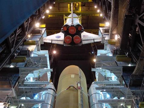 Filespace Shuttle Discovery Lowered Toward External Tank And Solid