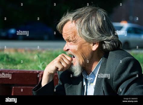 Yawning Old Man Stock Photo Alamy