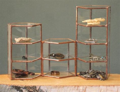 Geometric glass jewelry display case with copper finish | Glass shelves ...