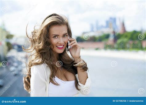 Happy Beautiful Blonde Girl Calling By Phone In A Summer Street Stock Photo Image Of Casual
