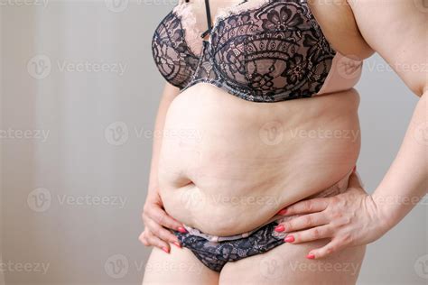 Cropped Shot White Woman In Lingerie Holding Fat Belly Large Sized