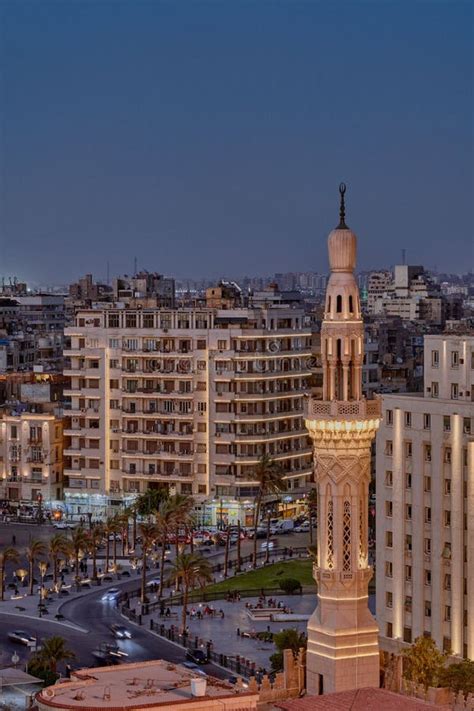 Aerial View Of Tahrir Square In Cairo At Night Featuring A Brightly