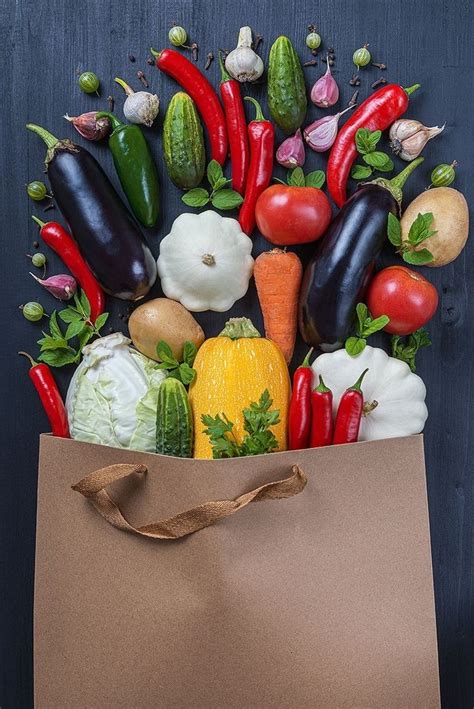 A Brown Paper Bag Filled With Lots Of Different Types Of Vegetables And