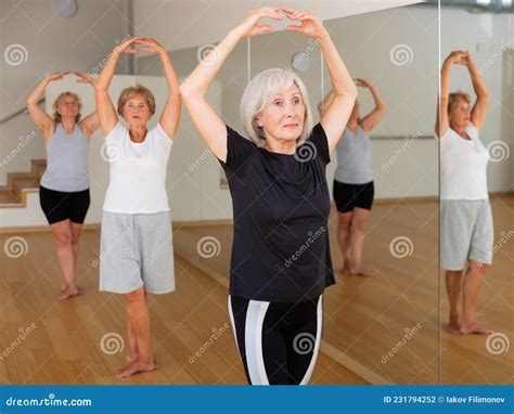 Mature Women Performing Ballet Dance In Exercise Room Stock Photo