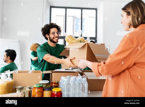 Volunteer Giving Food At Refugee Assistance Center Stock Photo Alamy