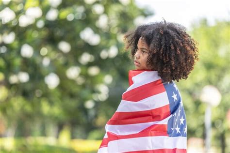 Premium Photo Girl Wrapped In American Flag Outdoors