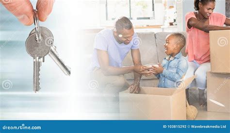 People Moving Boxes into New Home with Keys Stock Photo - Image of ...