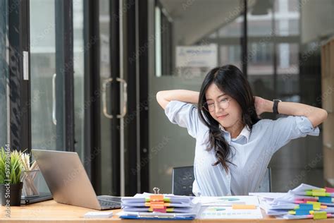 Asian Businesswoman Feel Tired From Hard Work Thus Doing Arm