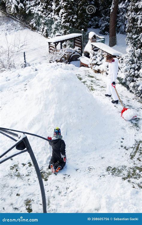 Two Kids Building a Snow Igloo in Winter Stock Photo - Image of playing ...