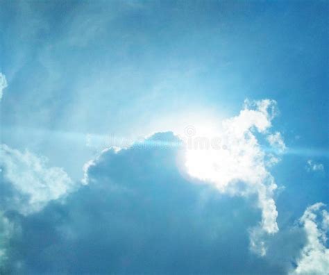 The Sun Brightly Shining In The Cloudy Sky Stock Photo - Image of ...