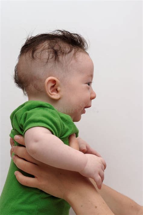 Cute Smiling Baby Held By His Mother Profile View Stock Images - Image ...