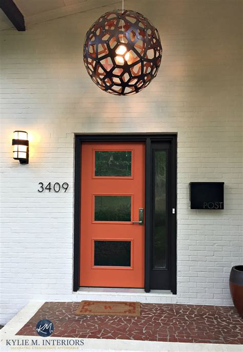 Exterior front door, mid century style painted orange with dark brown