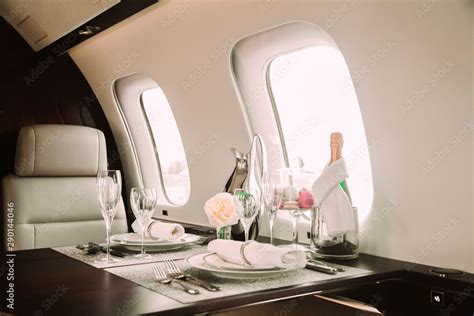 modern and comfortable interior of business jet aircraft with decor ...