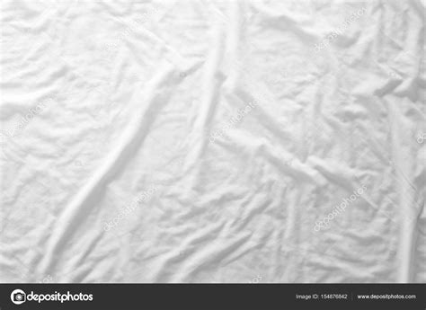 Top View Of Bedding Sheets Or White Fabric Wrinkle Texture Background