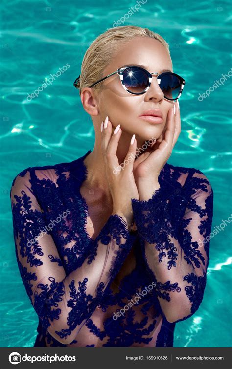 Beautiful Stunning Elegant Sexy Blonde Model Woman With Perfect Face Wearing A Sunglasses In A