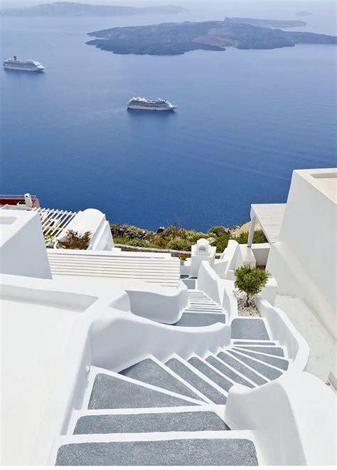 The Stairs Lead Down To An Outdoor Area With Boats In The Water And