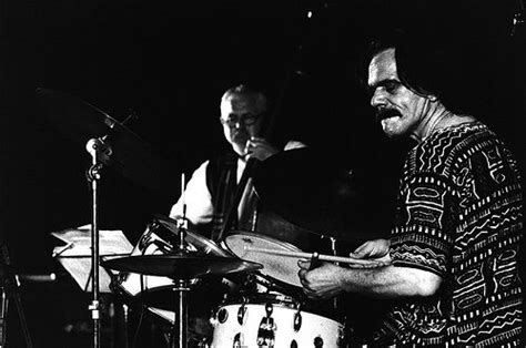 Black And White Photograph Of Two Men Playing Drums