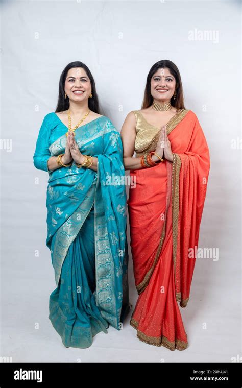 Two Happy Indian Women Greeting Join Hands Do Namaste Standing In