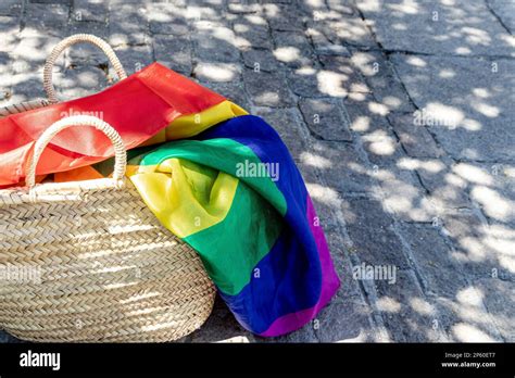 LGBT Rainbow Flag In A Wicker Basket On The Ground Gay Parade Freedom Tolerance Stock Photo